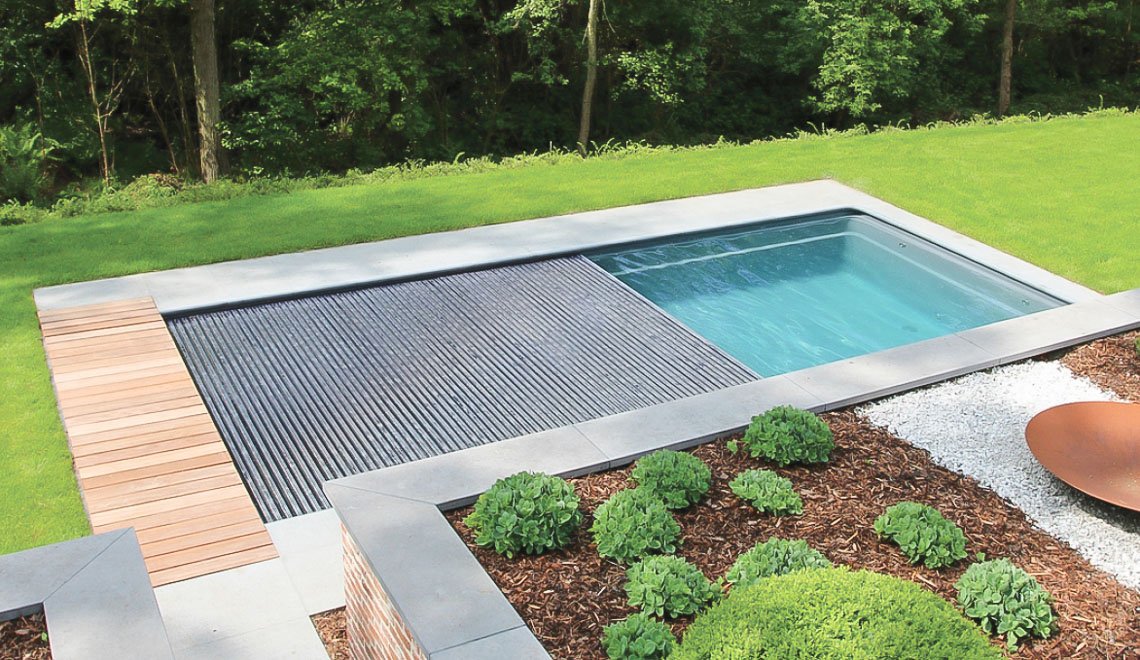 Northern Colorado Pools shows a backyard pool that makes relaxing and taking care of your yard easy.