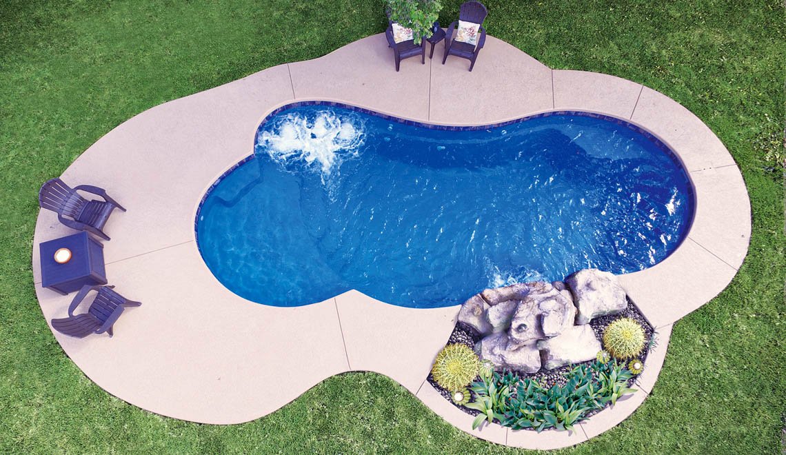 A Northern Colorado Pools backyard shows a relaxing, easy-care pool area ideal for family fun and unwinding outdoors.