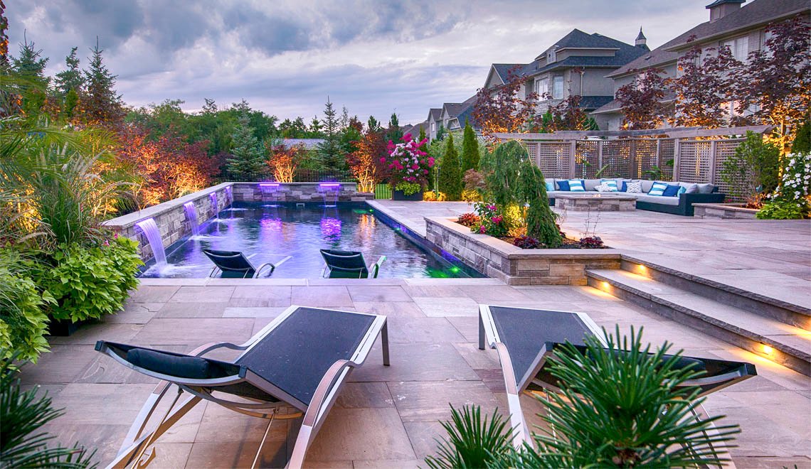 A relaxing, easy-care backyard oasis by Northern Colorado Pools, great for fun and family time in Mead, Colorado.