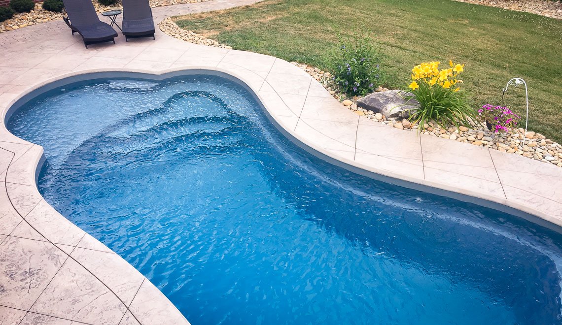 Northern Colorado Pools offers a simple, easy-care backyard pool designed for relaxation and outdoor fun.