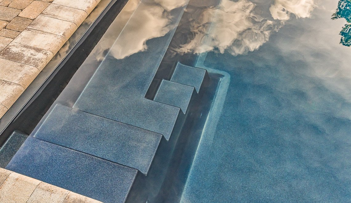 A clean, premium pool by Northern Colorado Pools shows expert design and installation for relaxing and fun backyard living.