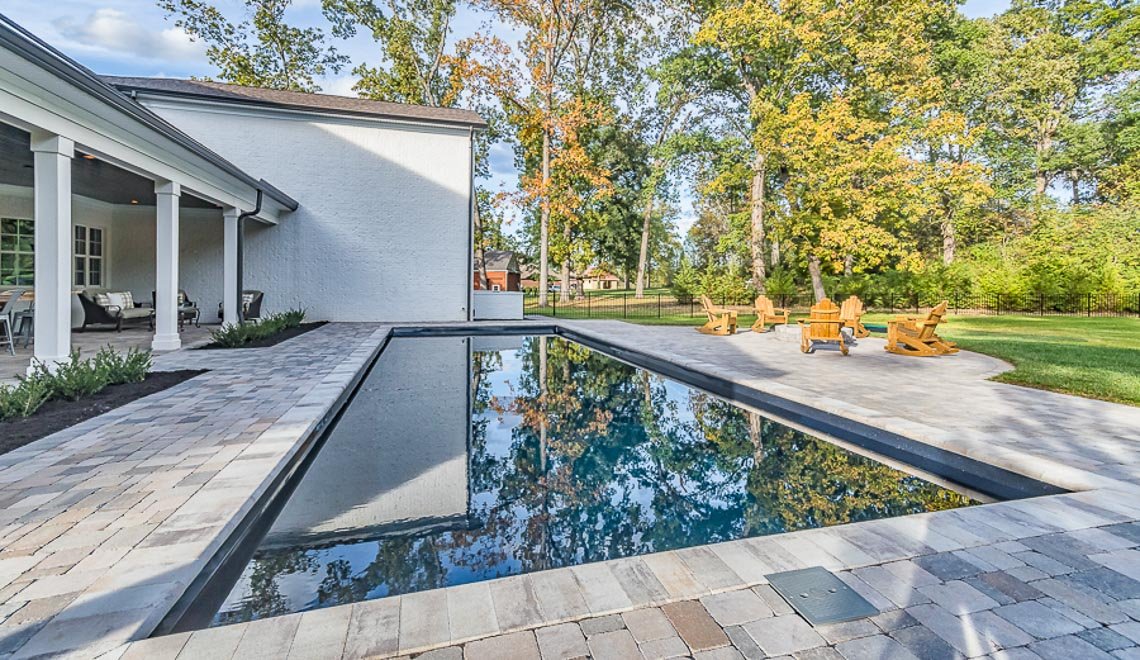 This is a simple, relaxing backyard pool space built for easy upkeep by Northern Colorado Pools in Mead, Colorado.