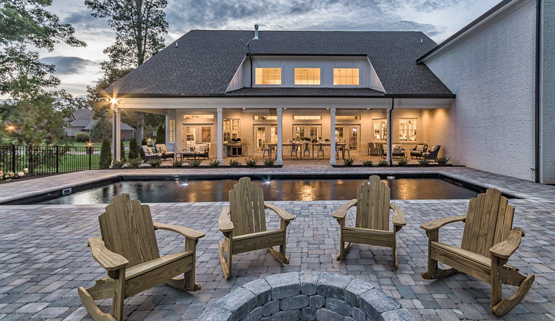 A welcoming patio and pool scene shows Northern Colorado Pools' quality design and service for Mead, Colorado families.