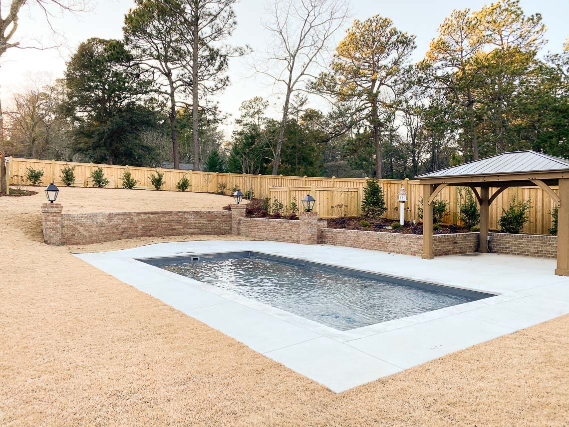 A backyard pool built by Northern Colorado Pools shows quality work in a peaceful outdoor setting with space to relax and enjoy.