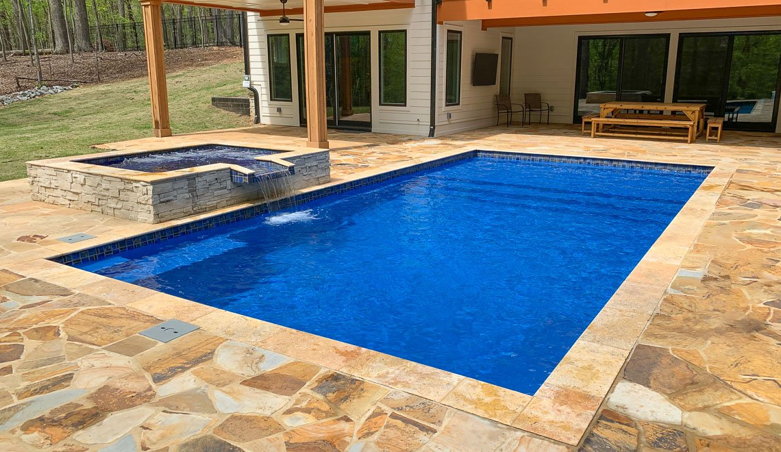 Northern Colorado Pools offers a backyard pool and spa showing quality work, comfort, and great service for families.