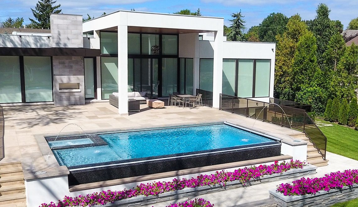 A beautiful home with a stylish pool and spa by Northern Colorado Pools, perfect for relaxing or fun with family and friends.