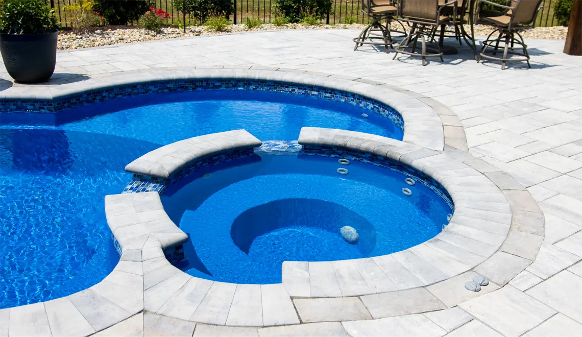 A relaxing outdoor space by Northern Colorado Pools, showing how your backyard can become a fun and comfortable gathering place.