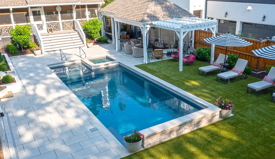 A welcoming backyard by Northern Colorado Pools shows inviting spaces for swimming, relaxing, and outdoor fun in Mead, Colorado.
